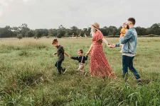 A family with kids on a field
