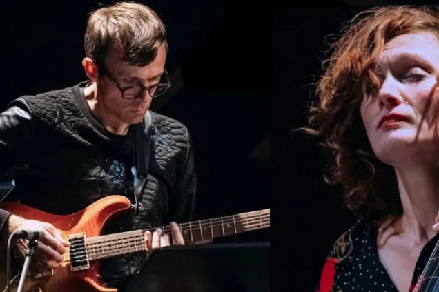 evatomeskuren.png Two musicians performing. Photo.